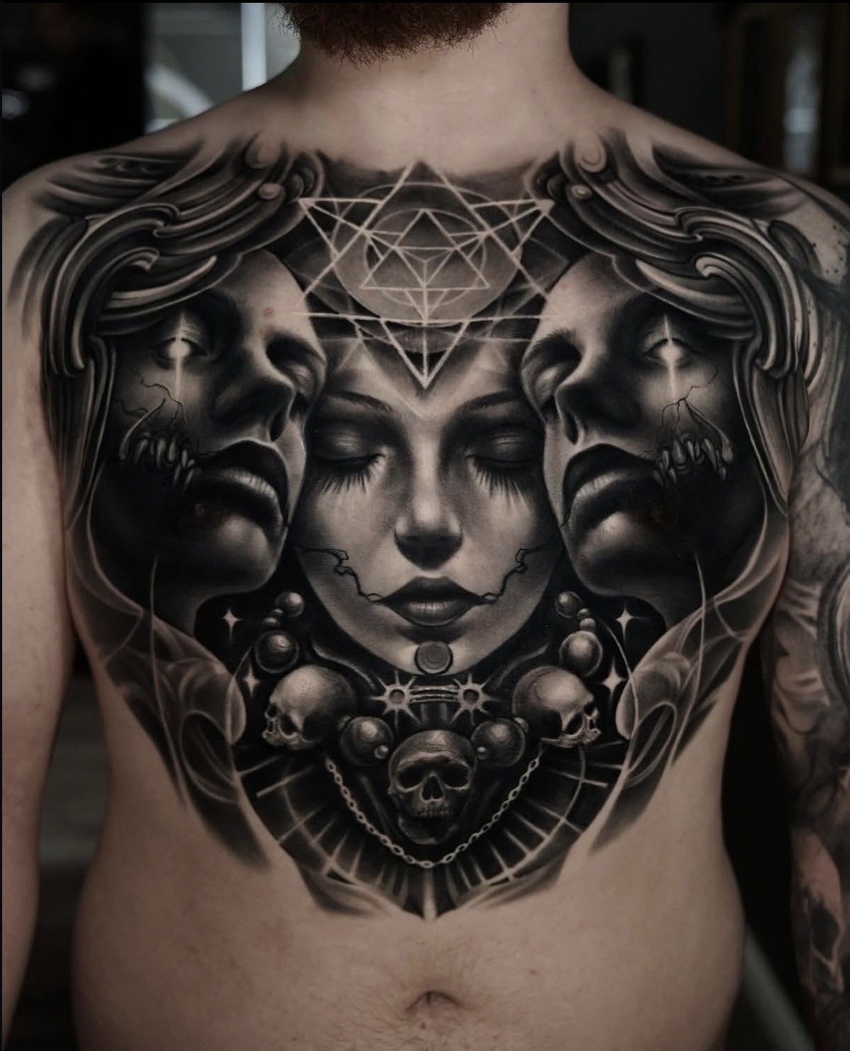 Full-back black-and-grey realism tattoo of a Roman statue